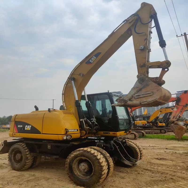 中古掘削機 オリジナルキャット M315D 0.61m3のバケツ付き 15トンの車輪掘削機