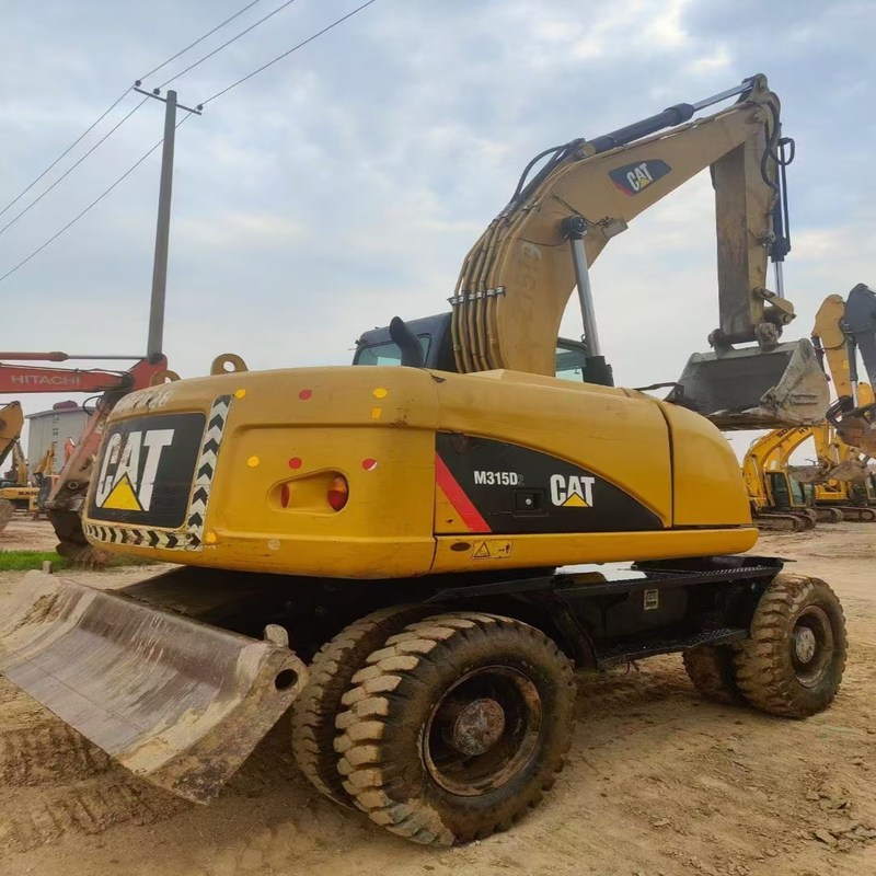 中古掘削機 オリジナルキャット M315D 0.61m3のバケツ付き 15トンの車輪掘削機