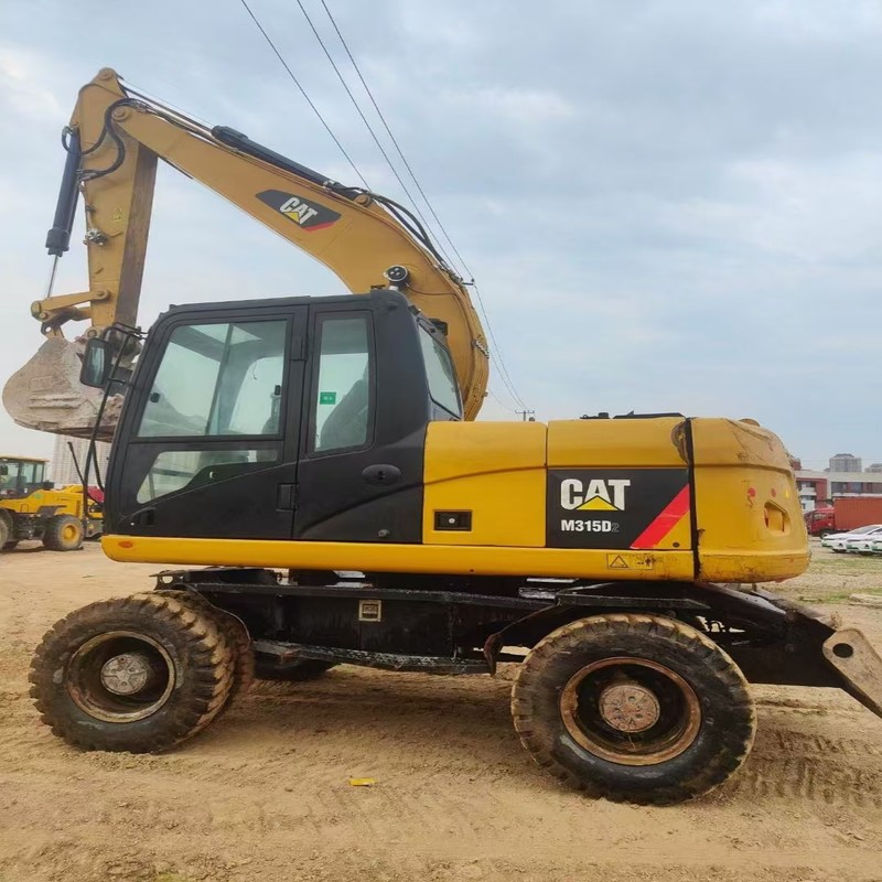 中古掘削機 オリジナルキャット M315D 0.61m3のバケツ付き 15トンの車輪掘削機